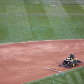 Oakland Coliseum head groundskeeper Clay Wood drags the infield dirt to smooth it over on Tuesday, September 22, 2015, prior to a baseball game between the Oakland Athletics and the Texas Rangers. The Oakland Coliseum is the only stadium in America to be shared by an NFL and MLB team.